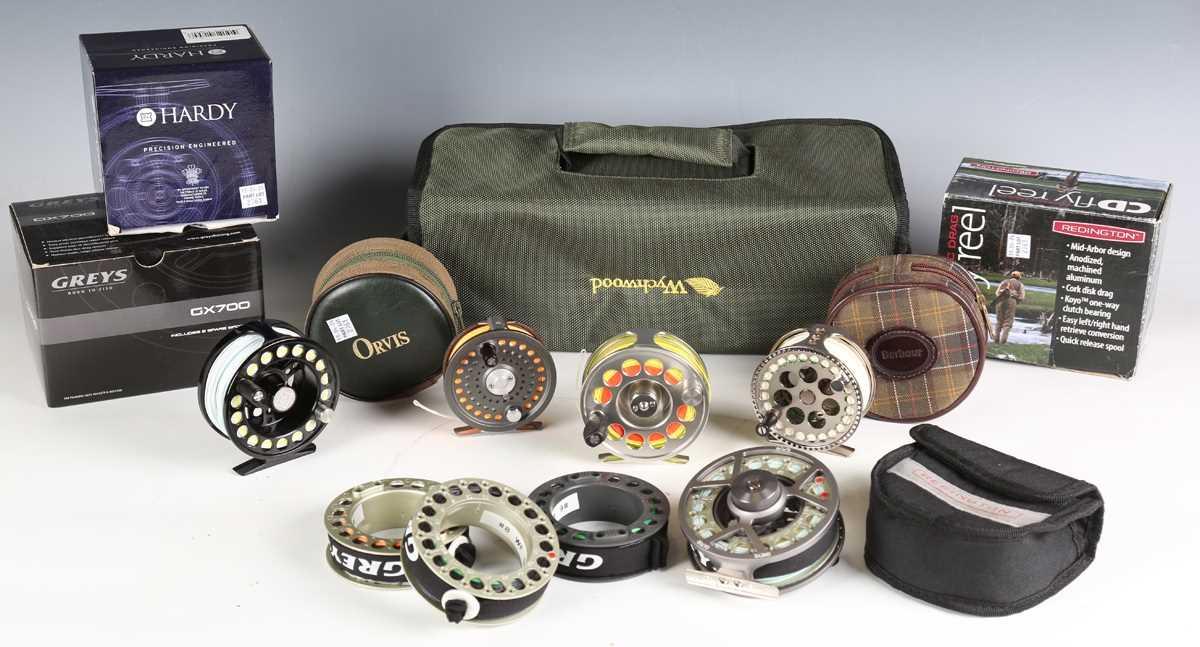 A group of five modern fly fishing reels, including a Hardy 'Uniqua' 5/6, diameter 9cm, boxed, an