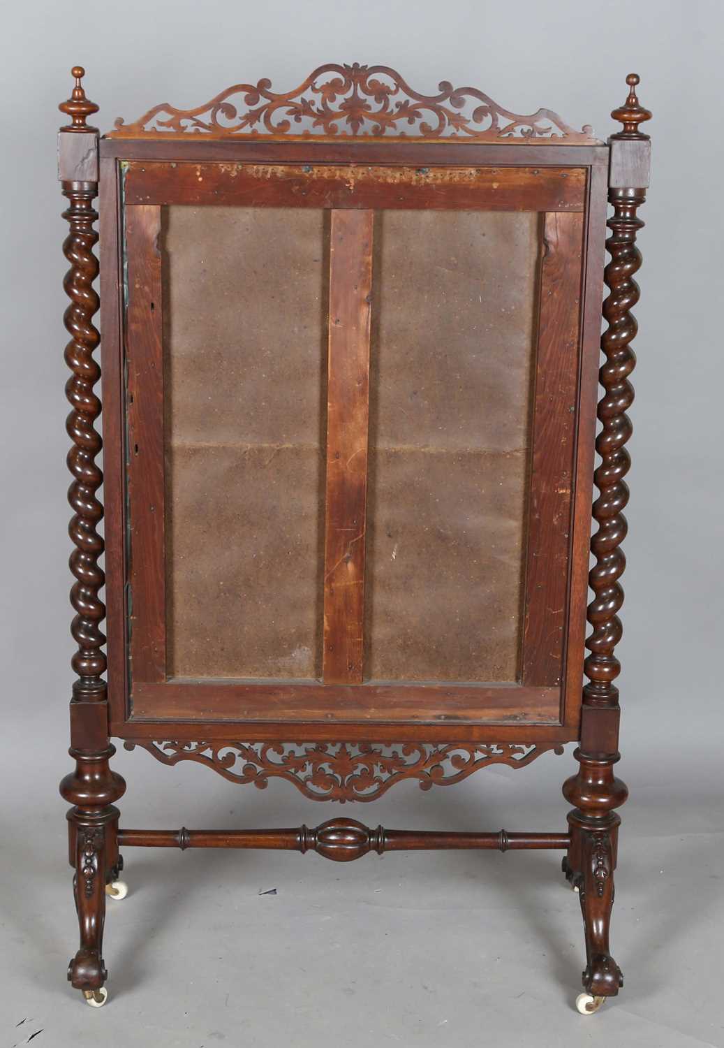 A large mid-Victorian walnut framed firescreen, inset with a woolwork panel and raised on carved - Image 12 of 13