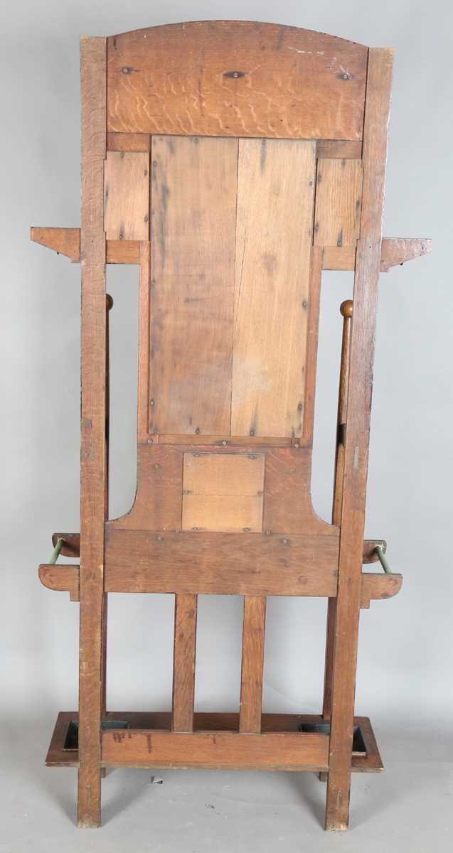 An Edwardian Arts and Crafts Glasgow School oak hallstand, the mirrored back inset with glazed - Image 13 of 13