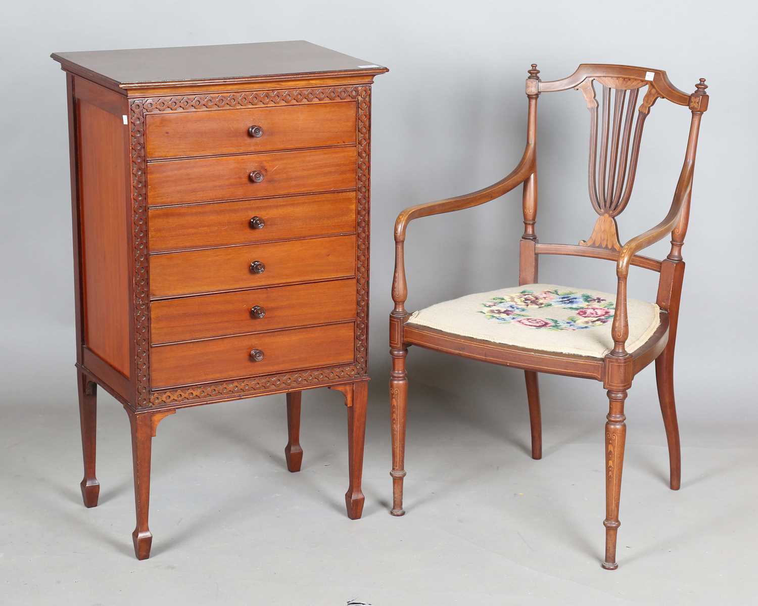 An Edwardian mahogany six-drawer music chest with blind fretwork decoration, height 94cm, width