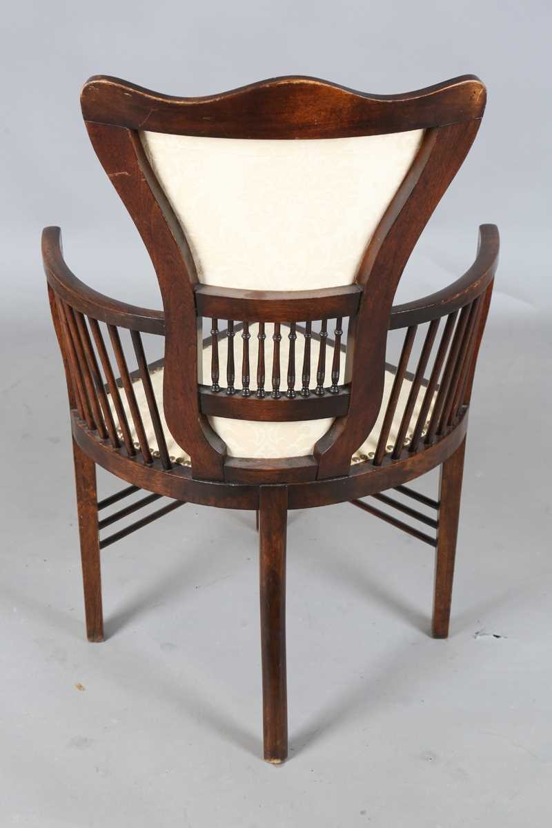 An Edwardian Arts and Crafts style stained walnut showframe armchair, upholstered in cream fabric, - Image 13 of 17