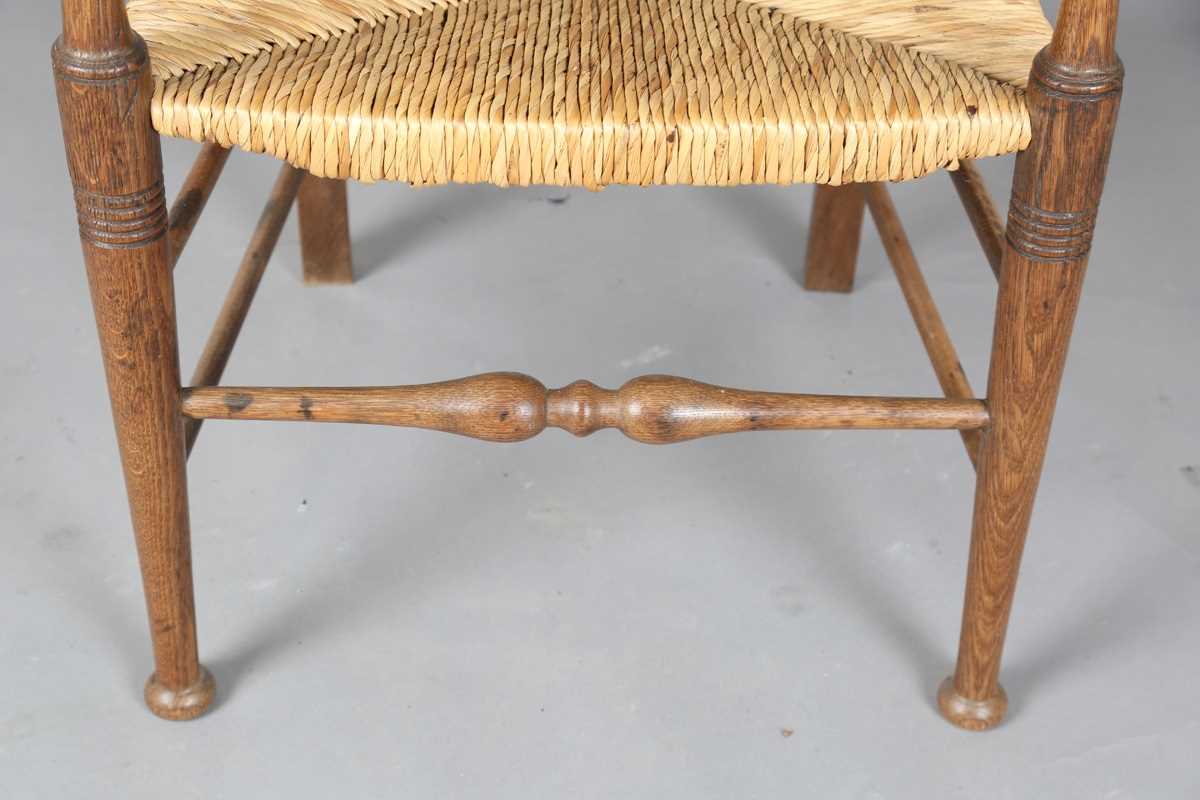 An Edwardian Arts and Crafts oak framed elbow chair, in the manner of William Birch, height 107cm, - Image 4 of 8