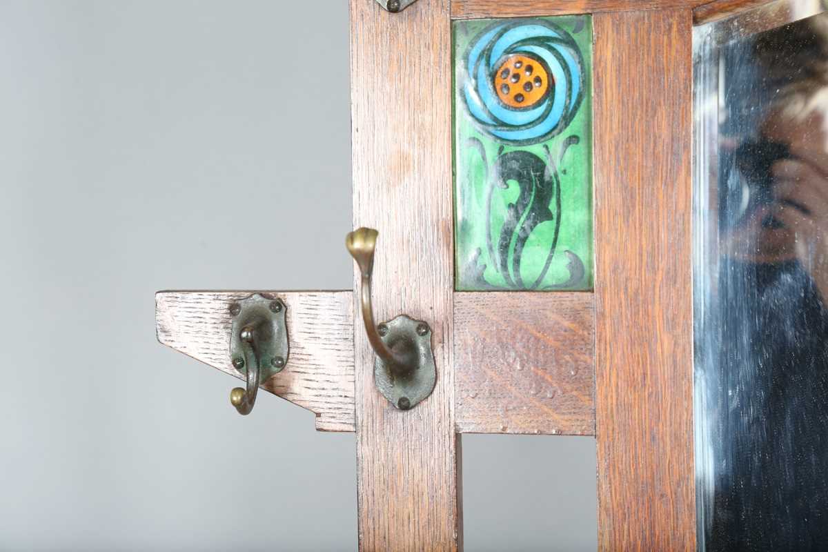 An Edwardian Arts and Crafts Glasgow School oak hallstand, the mirrored back inset with glazed - Image 5 of 13