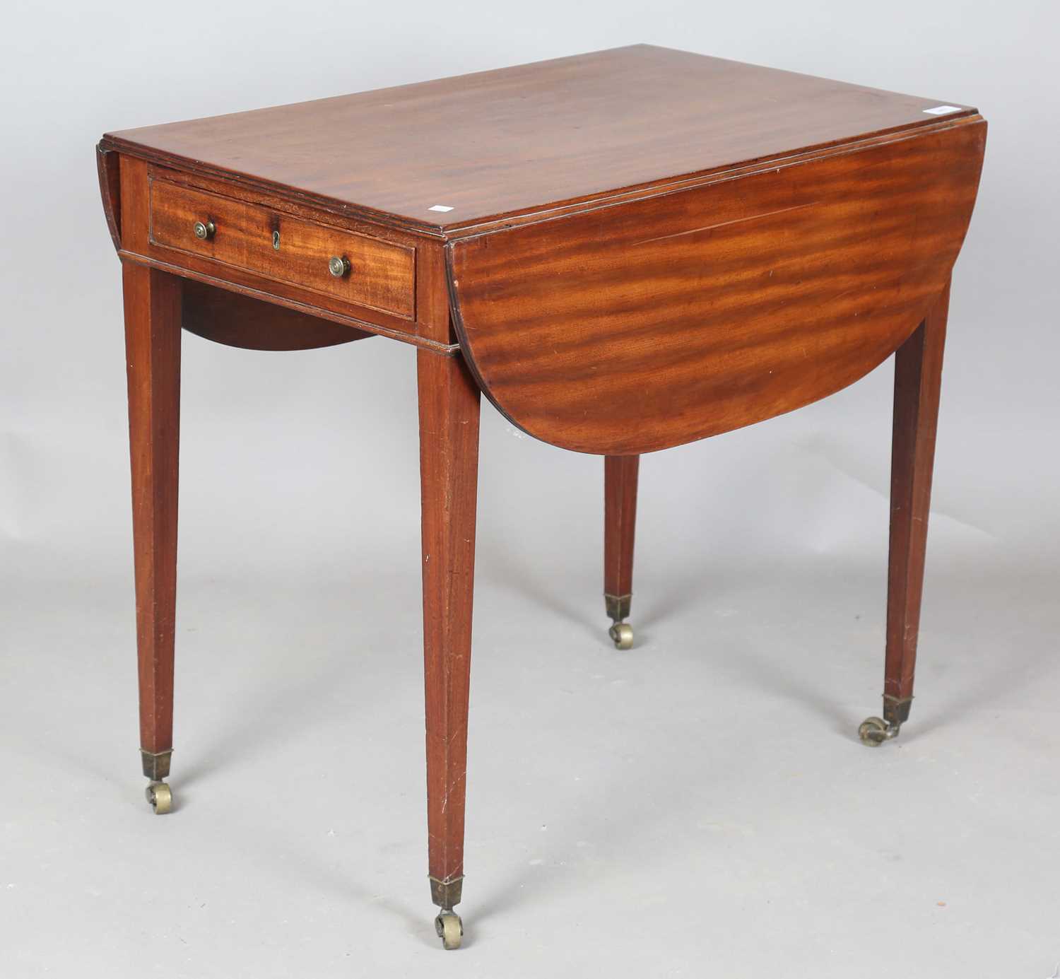 A late George III mahogany Pembroke table, fitted with a frieze drawer, on square tapering legs