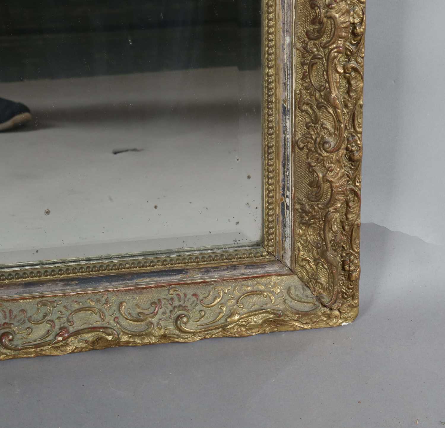 A late 19th century gilt composition arched overmantel mirror with a foliate scroll surmount and - Image 7 of 15