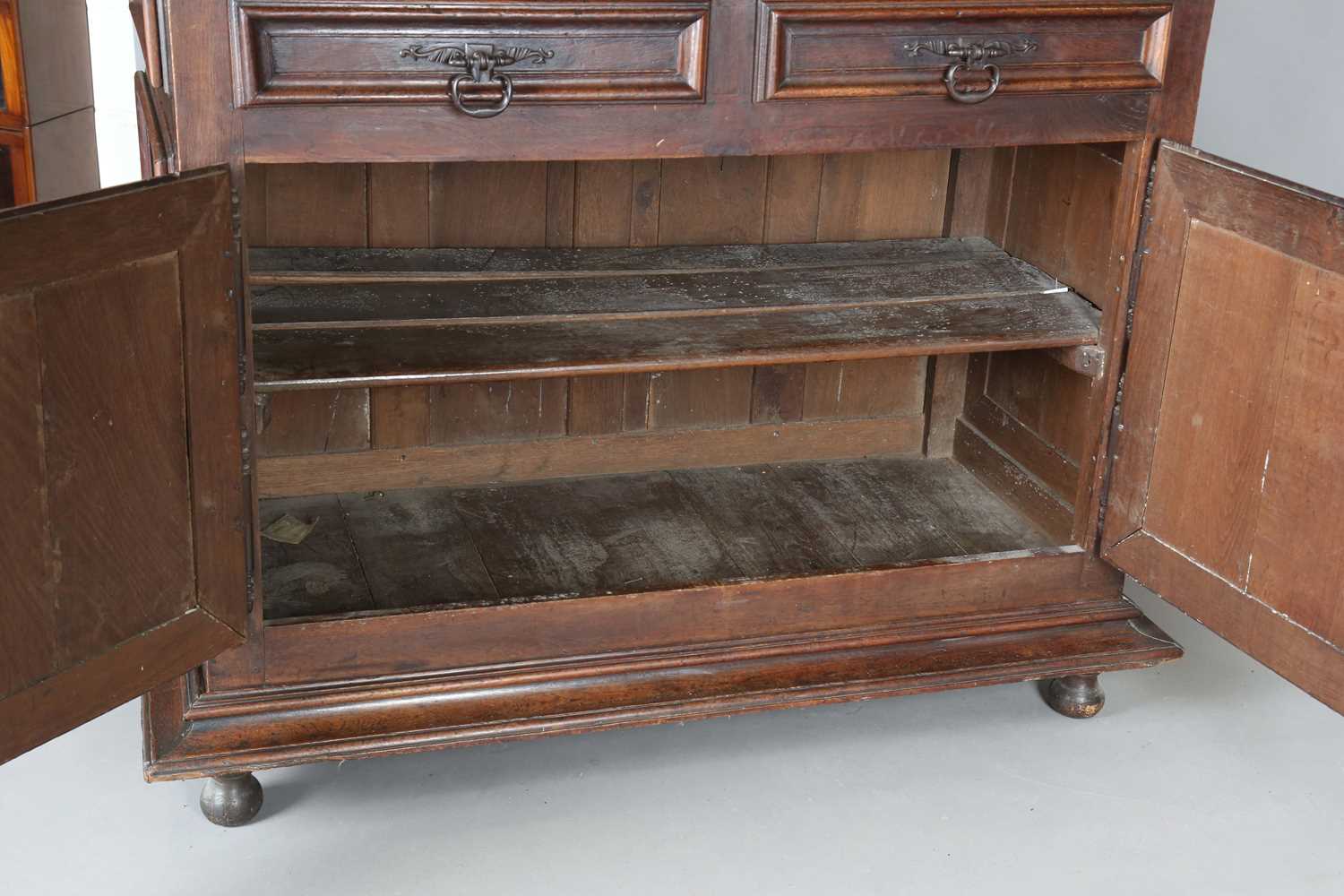 A large 18th century Continental oak cupboard, fitted with four panelled doors and two drawers, - Image 8 of 17