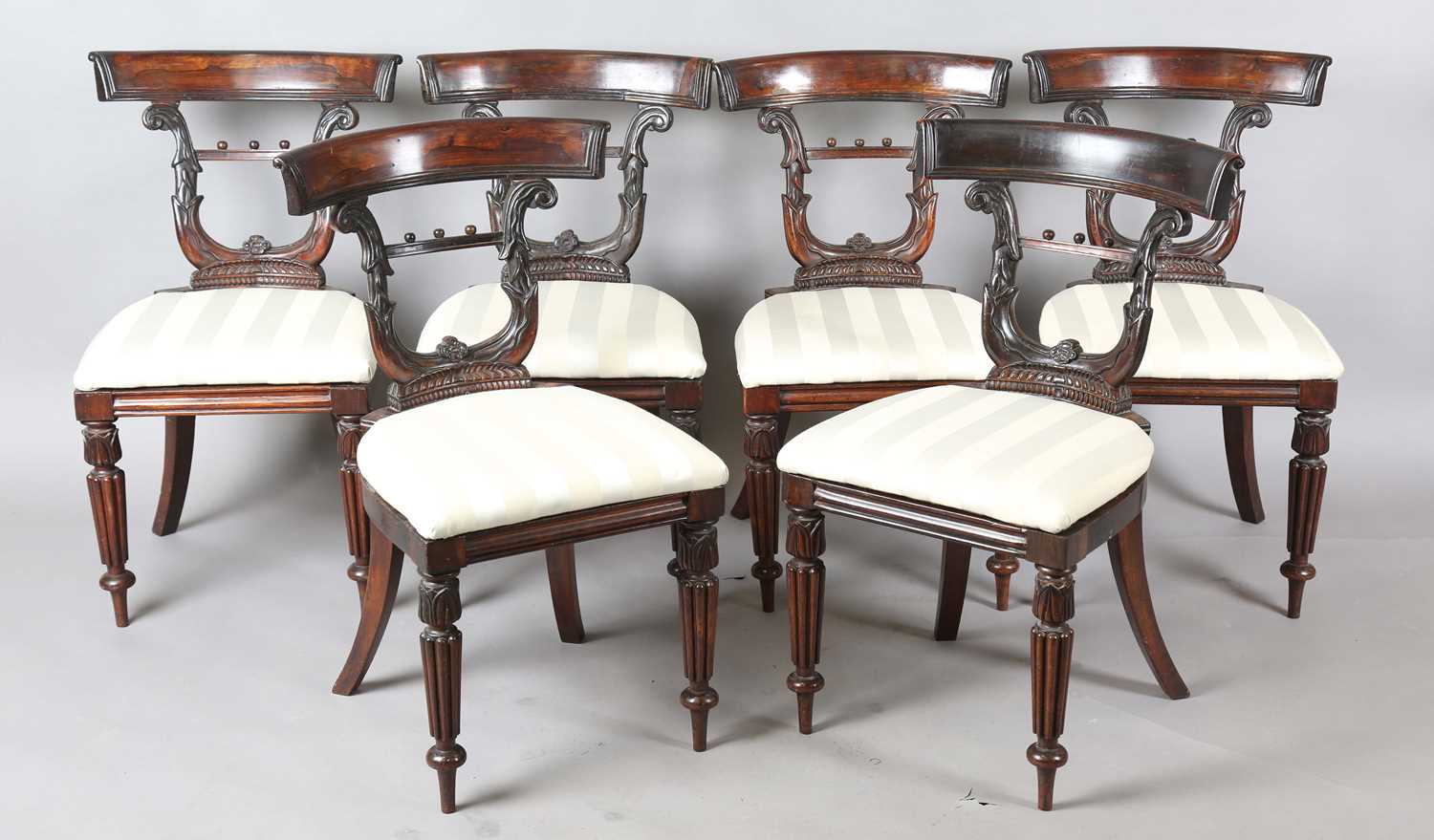A set of six unusual Regency rosewood dining chairs, in the manner of Gillows of Lancaster, the