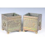A pair of late Victorian Aesthetic Movement brass square planters, in the manner of Bruce Talbert,