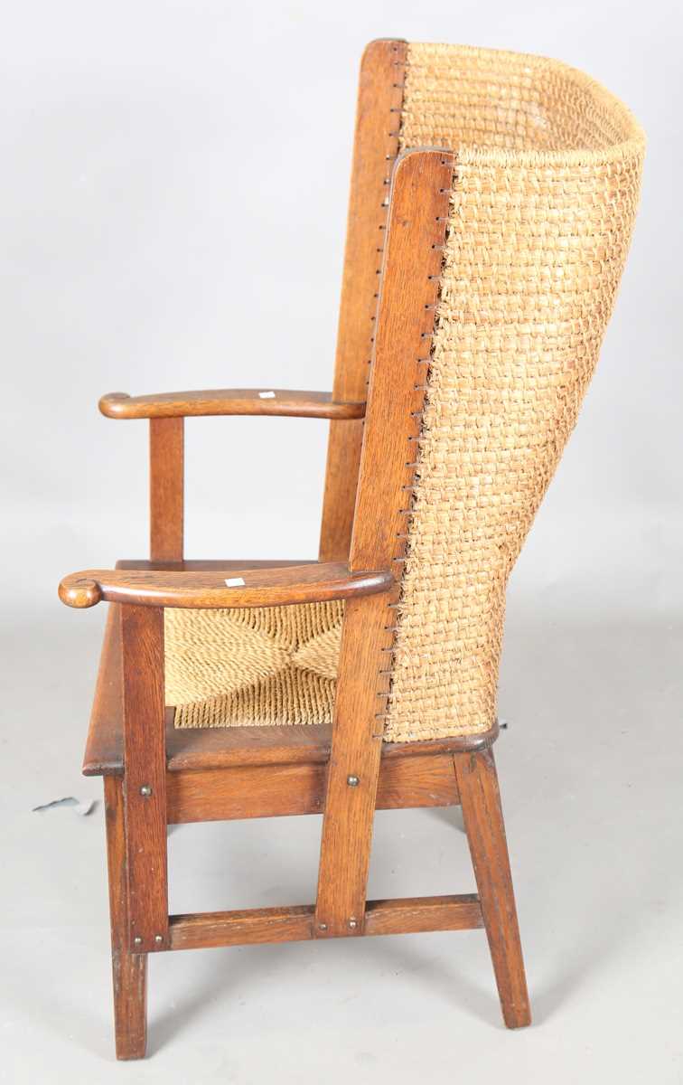 An early 20th century oak framed Orkney armchair, the curved woven straw back and string seat raised - Image 12 of 14