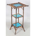 A late Victorian Aesthetic Movement bamboo three-tier table, inset with three turquoise glazed tiles