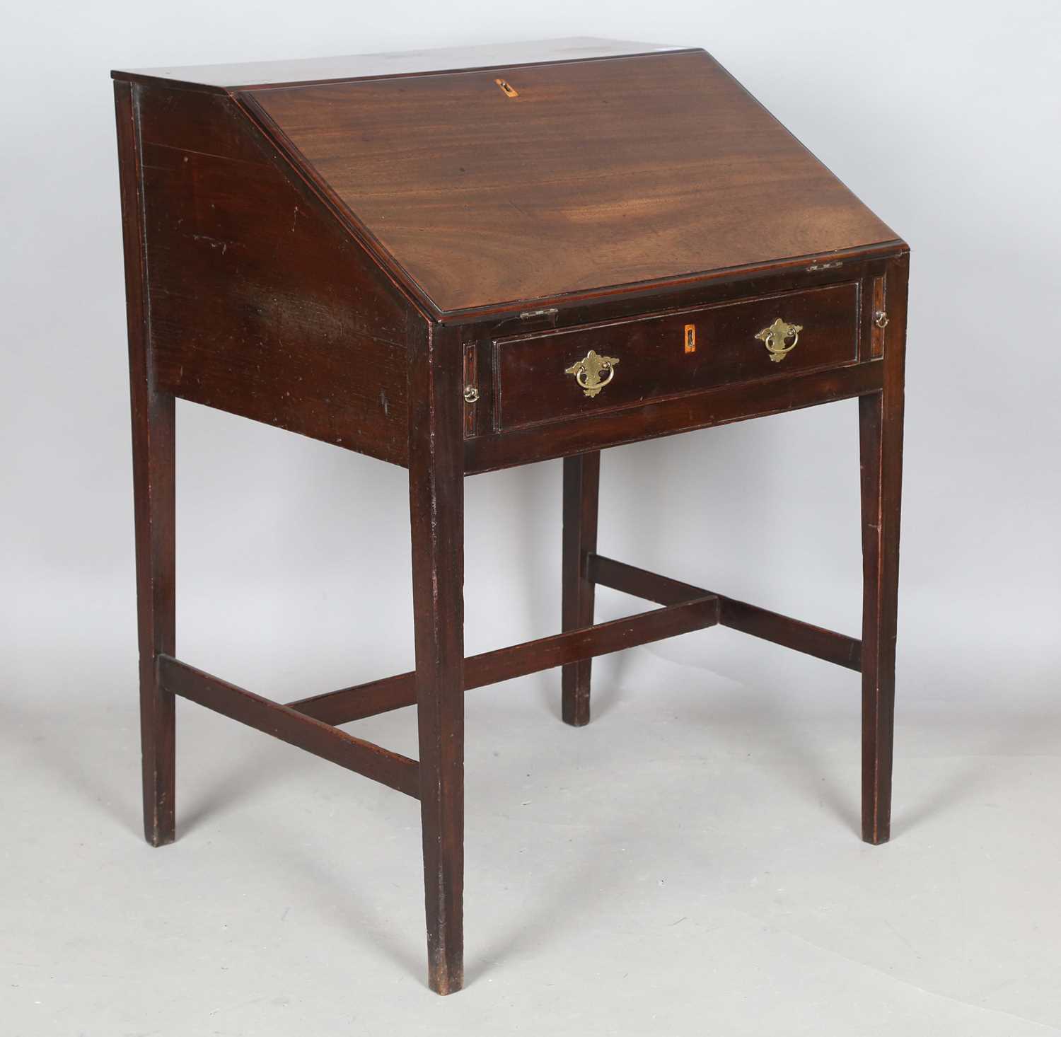 A George III mahogany clerk's desk, the fall front enclosing a fitted interior, height 95cm, width