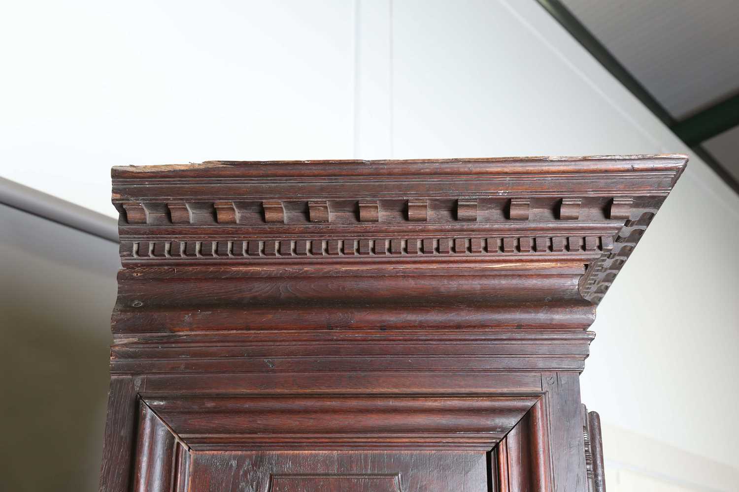 A large 18th century Continental oak cupboard, fitted with four panelled doors and two drawers, - Image 9 of 17