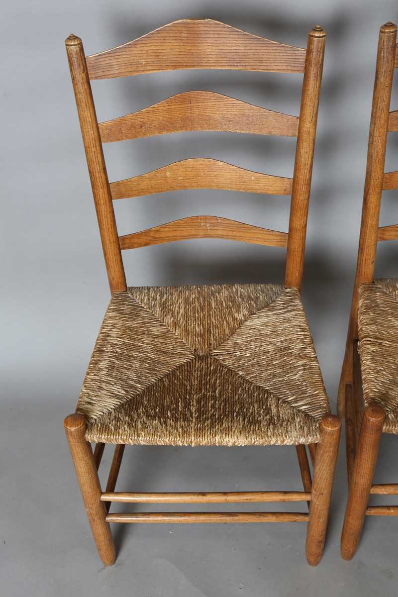 A set of six early 20th century Arts and Crafts ash framed ladder back chairs, in the manner of - Image 14 of 15