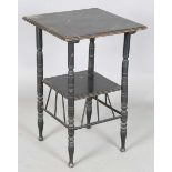A late Victorian Aesthetic Movement ebonized two-tier table, in the manner of E.W. Godwin, the