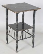 A late Victorian Aesthetic Movement ebonized two-tier table, in the manner of E.W. Godwin, the