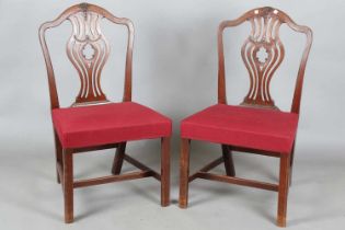 A pair of George III Chippendale period mahogany dining chairs with pierced splat backs and