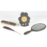 An Edwardian Irish bog oak timepiece of clover leaf form, width 12cm, together with a similar