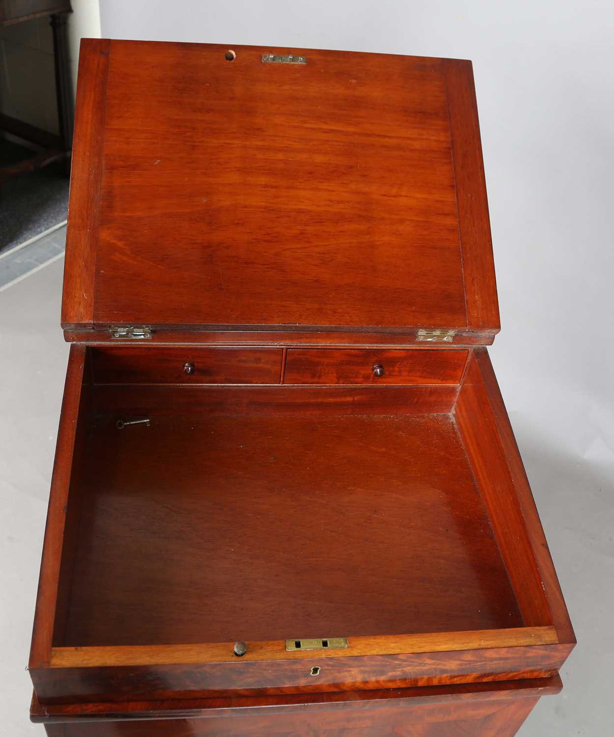 A good early Victorian flame mahogany Davenport, the hinged writing slope inset with tooled - Image 4 of 12