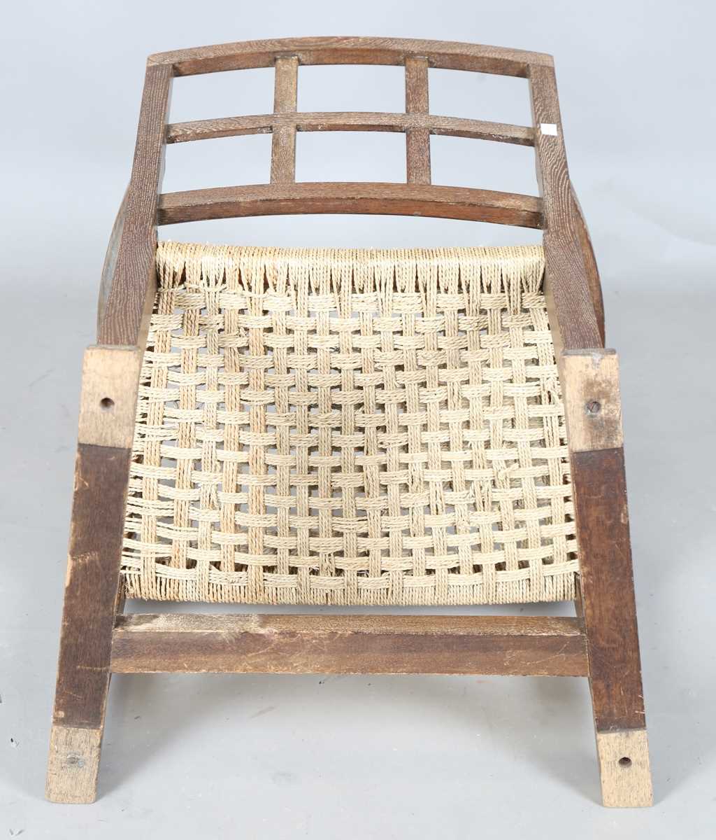 An early 20th century Cotswold School limed oak low elbow chair with woven string seat, height 70cm, - Image 10 of 10