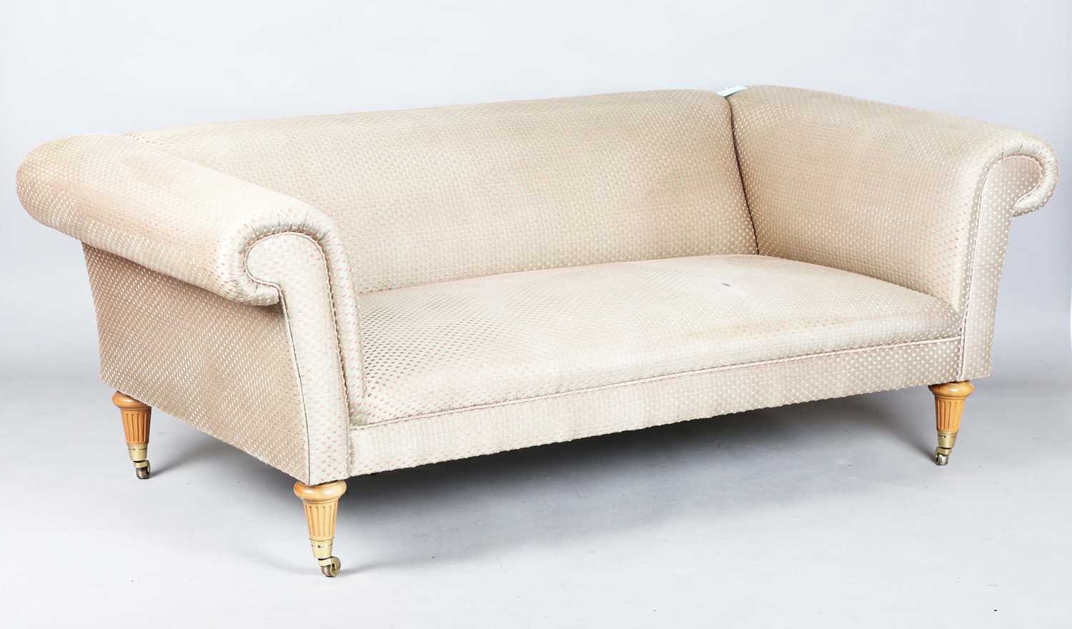 A David Linley scroll arm sofa, upholstered in pink dotted gilt damask, raised on fluted wooden legs