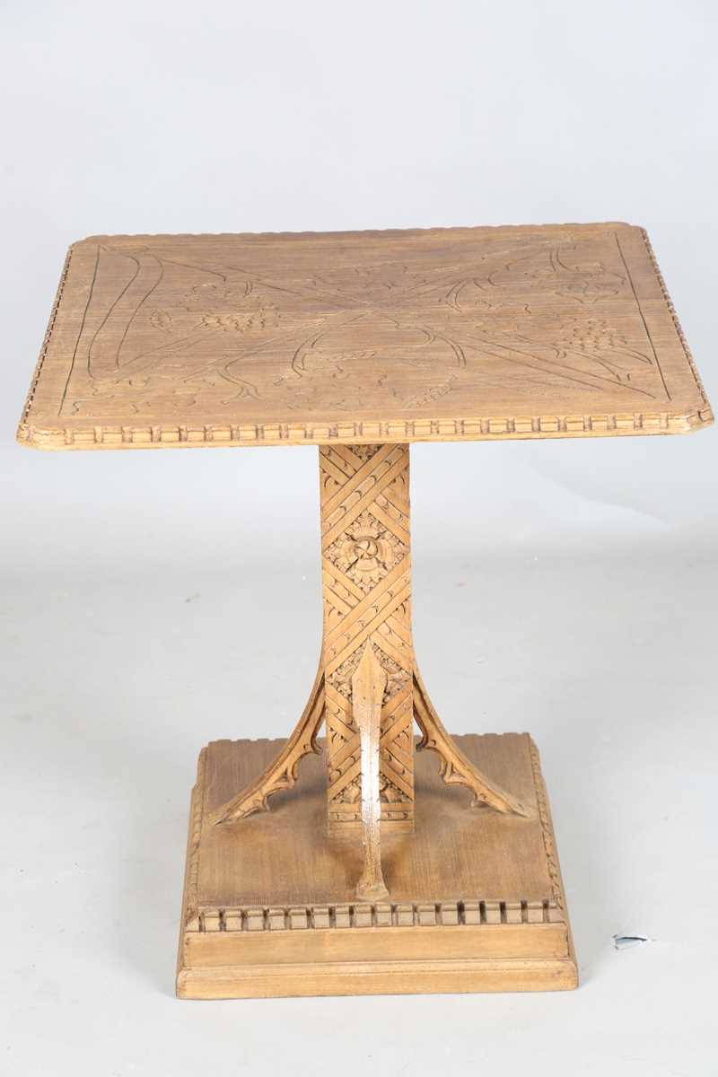 A 20th century Arts and Crafts style carved softwood centre table, the top decorated with wheat - Image 10 of 10