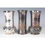 A pair of Keswick School of Industrial Arts plated copper vases, the hammered bodies with bulbous