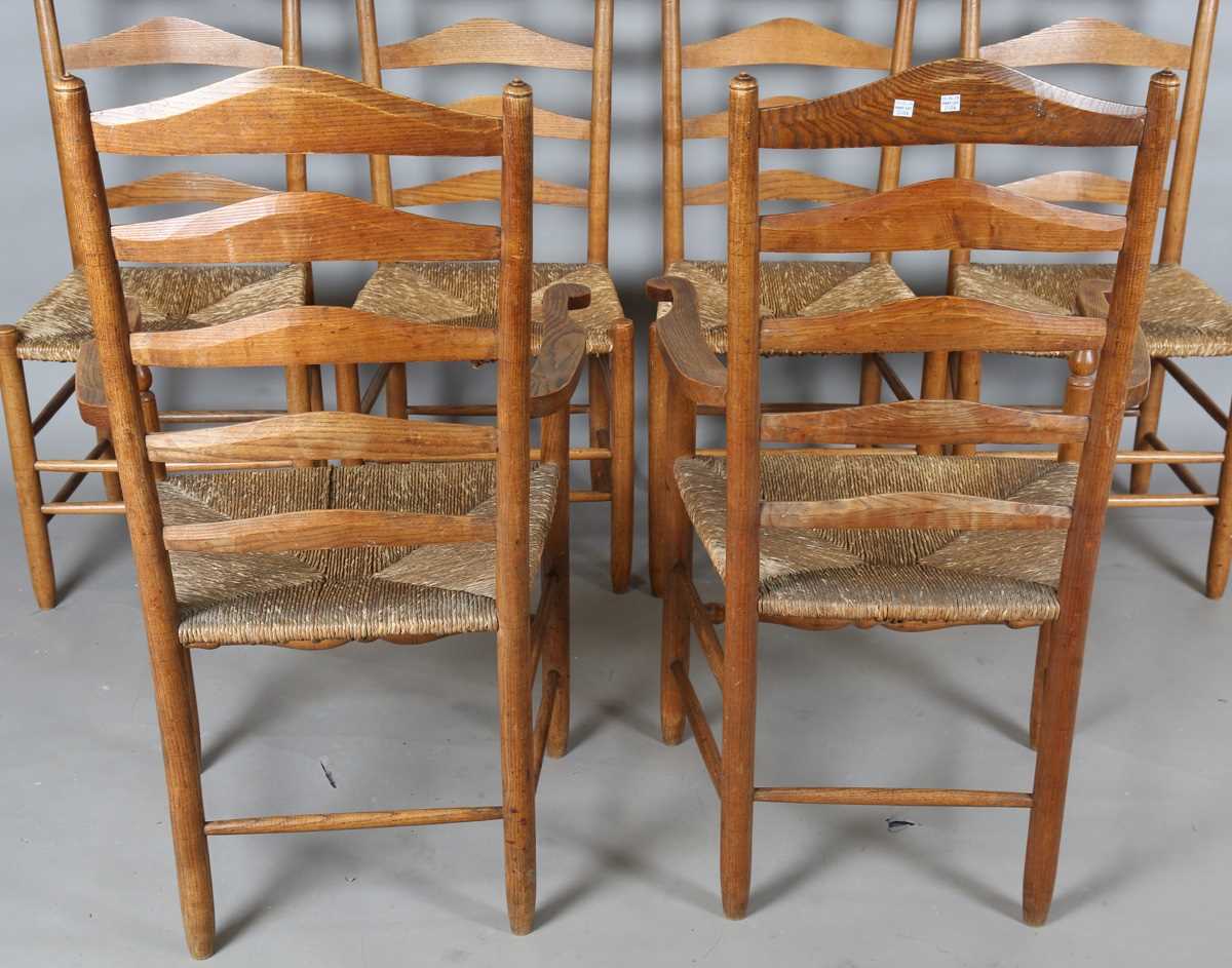 A set of six early 20th century Arts and Crafts ash framed ladder back chairs, in the manner of - Image 9 of 15