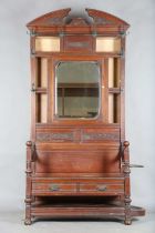 A late Victorian walnut hallstand with mirror back and box seat, height 230cm, width 107cm (faults).