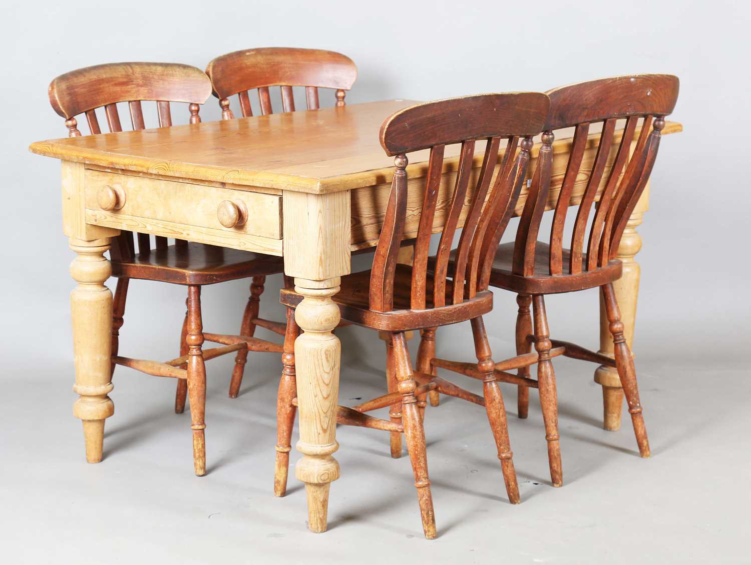 A set of four late 19th century ash and beech comb back kitchen chairs, height 89cm, width 47cm,