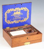 A late Victorian mahogany cased artist's box by Winsor & Newton, 'By Appointment to Her Majesty',