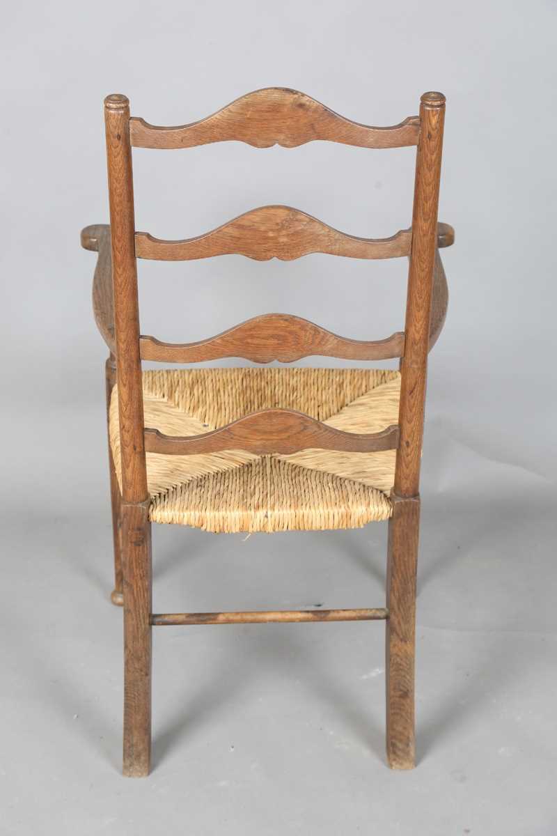 An Edwardian Arts and Crafts oak framed elbow chair, in the manner of William Birch, height 107cm, - Image 7 of 8