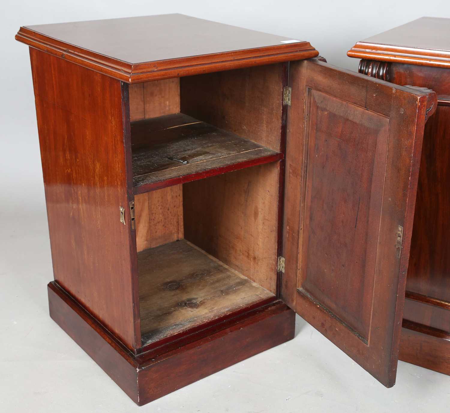 A pair of Victorian and later mahogany pedestal cabinets, each fitted with an arched panel door, - Image 3 of 10