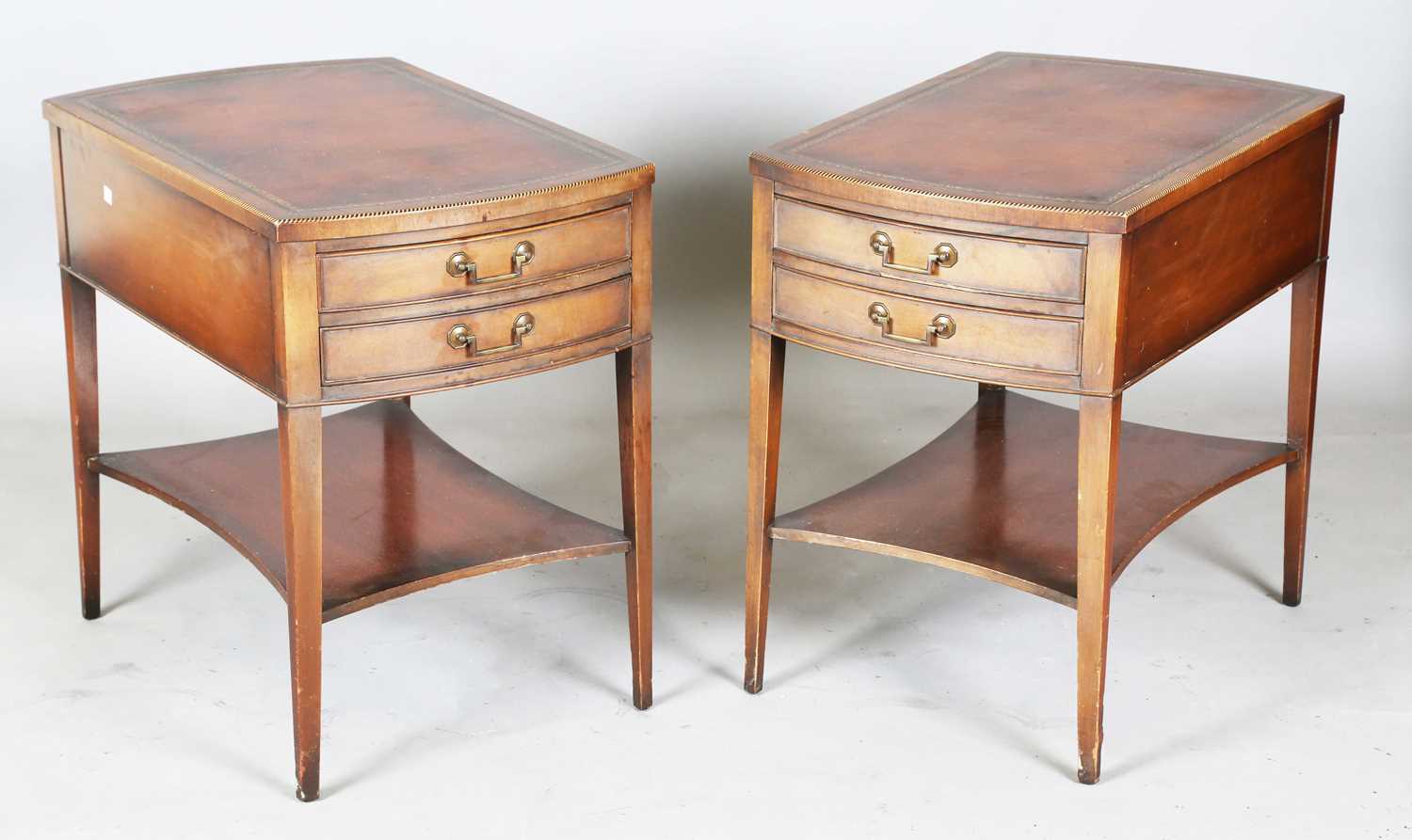 A pair of 20th century mahogany reproduction bowfront lamp or bedside tables, each chequer banded