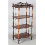 A Victorian rosewood serpentine-fronted four-tier whatnot, height 125cm, width 56cm, depth 36cm.