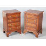 A pair of late 20th century reproduction mahogany bedside chests of four drawers, height 61cm, width