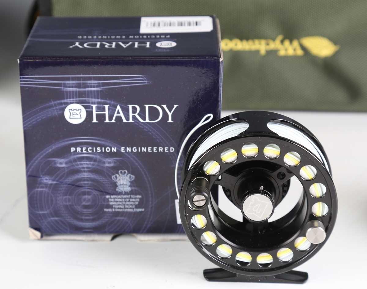 A group of five modern fly fishing reels, including a Hardy 'Uniqua' 5/6, diameter 9cm, boxed, an - Image 7 of 10