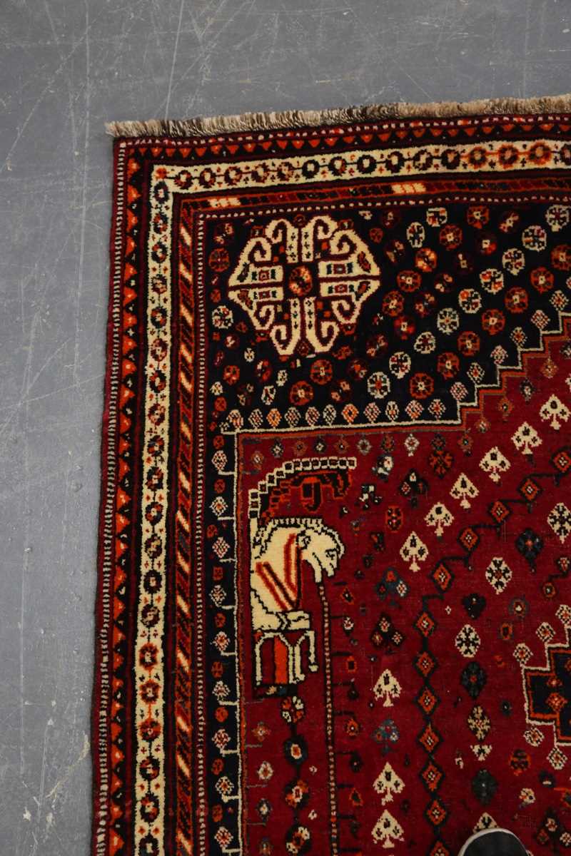 A Ghashghai rug, South-west Persia, late 20th century, the red field with three linked medallions, - Image 2 of 7