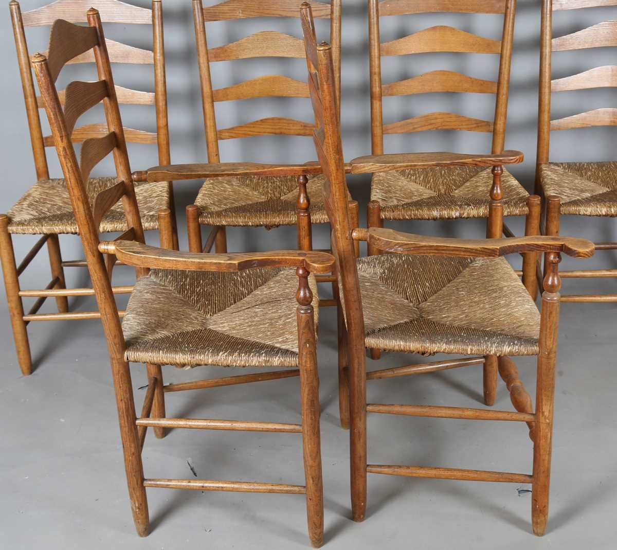 A set of six early 20th century Arts and Crafts ash framed ladder back chairs, in the manner of - Image 8 of 15