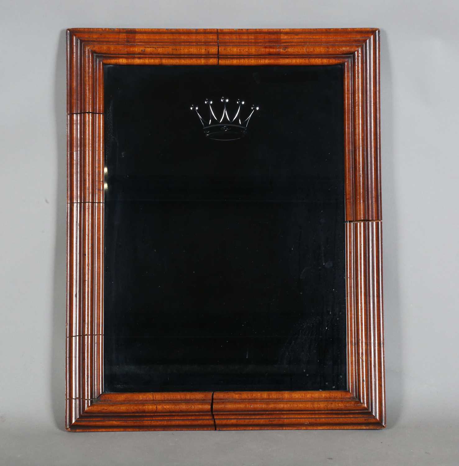 A Queen Anne walnut cushion section frame, inset with a later tinted-glass mirror etched with a