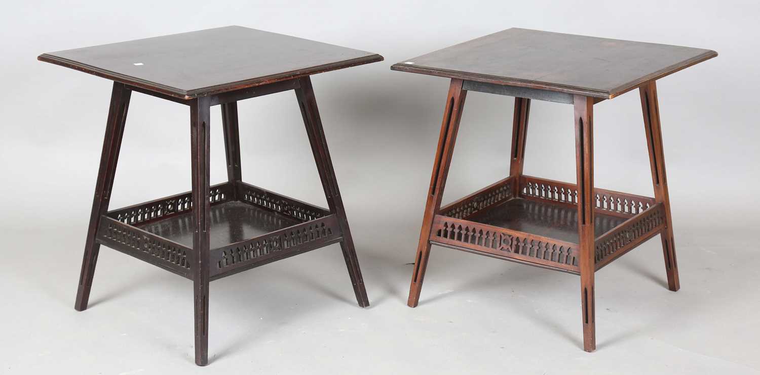 A near pair of Edwardian mahogany square occasional tables, attributed to James Shoolbred, the