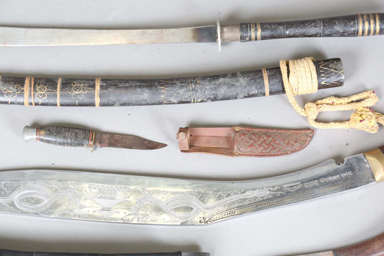 A collection of edged weapons, including a Bundeswehr MI211 military combat knife with single- - Image 7 of 9