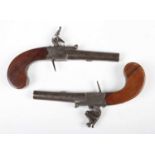 A pair of early 19th century flintlock pistols by Wheeler, London, with round turn-off barrels,