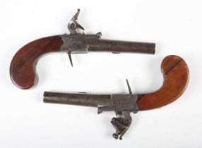 A pair of early 19th century flintlock pistols by Wheeler, London, with round turn-off barrels,