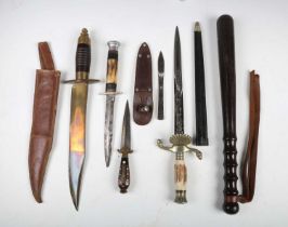 A small group of knives and edged weapons, including a mid-20th century hunting knife with etched