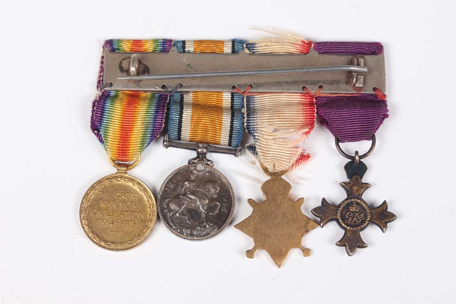 A group of four First World War period medals, comprising OBE, military issue, London 1929, 1914- - Image 9 of 9