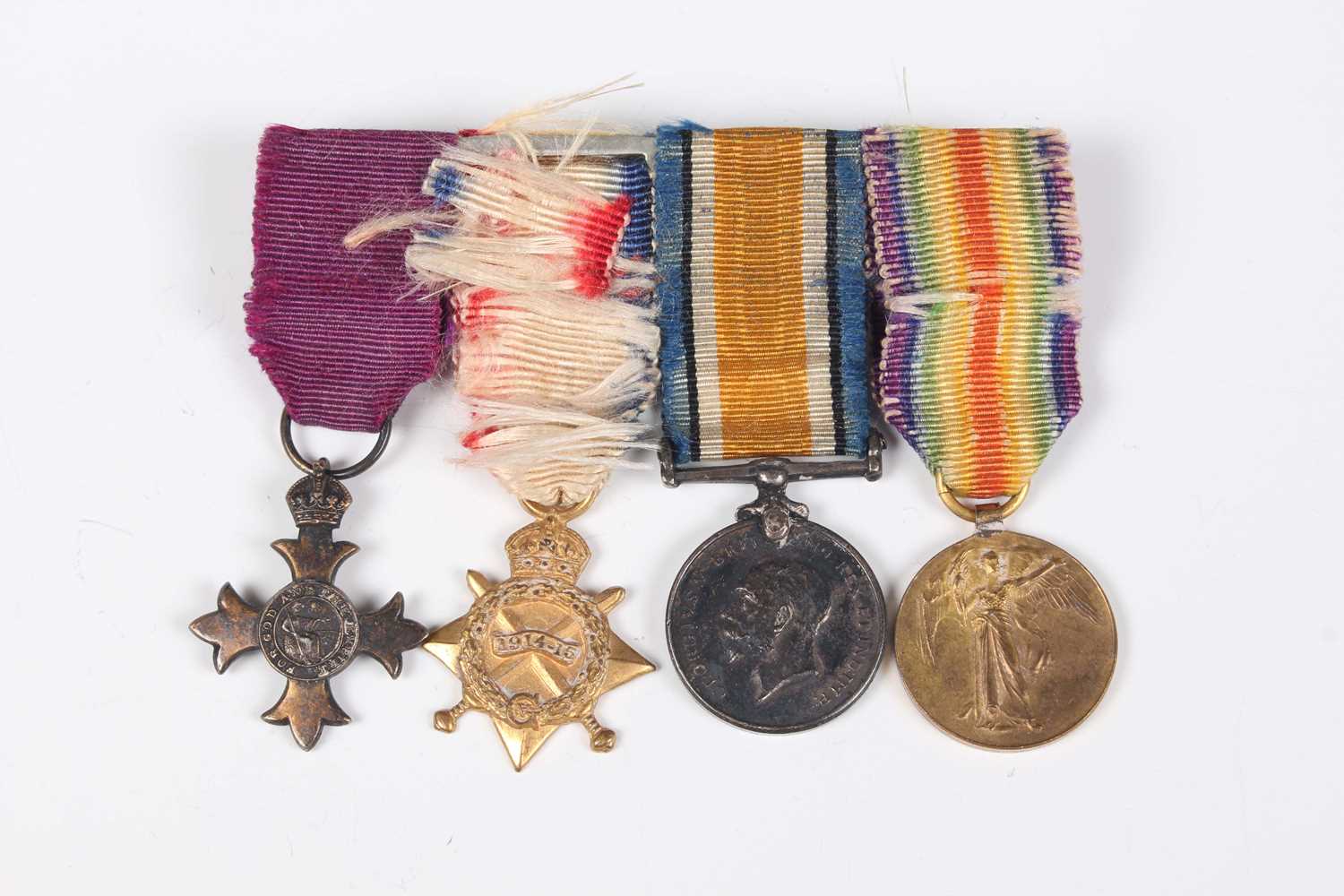 A group of four First World War period medals, comprising OBE, military issue, London 1929, 1914- - Image 8 of 9