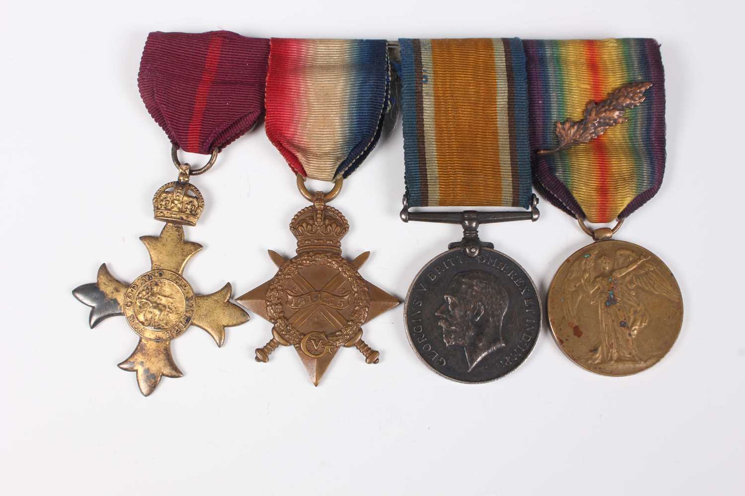 A group of four First World War period medals, comprising OBE, military issue, London 1929, 1914- - Image 2 of 9