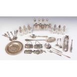 A small group of silver, including a serving spoon with embossed and engraved decoration,