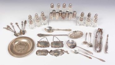A small group of silver, including a serving spoon with embossed and engraved decoration,