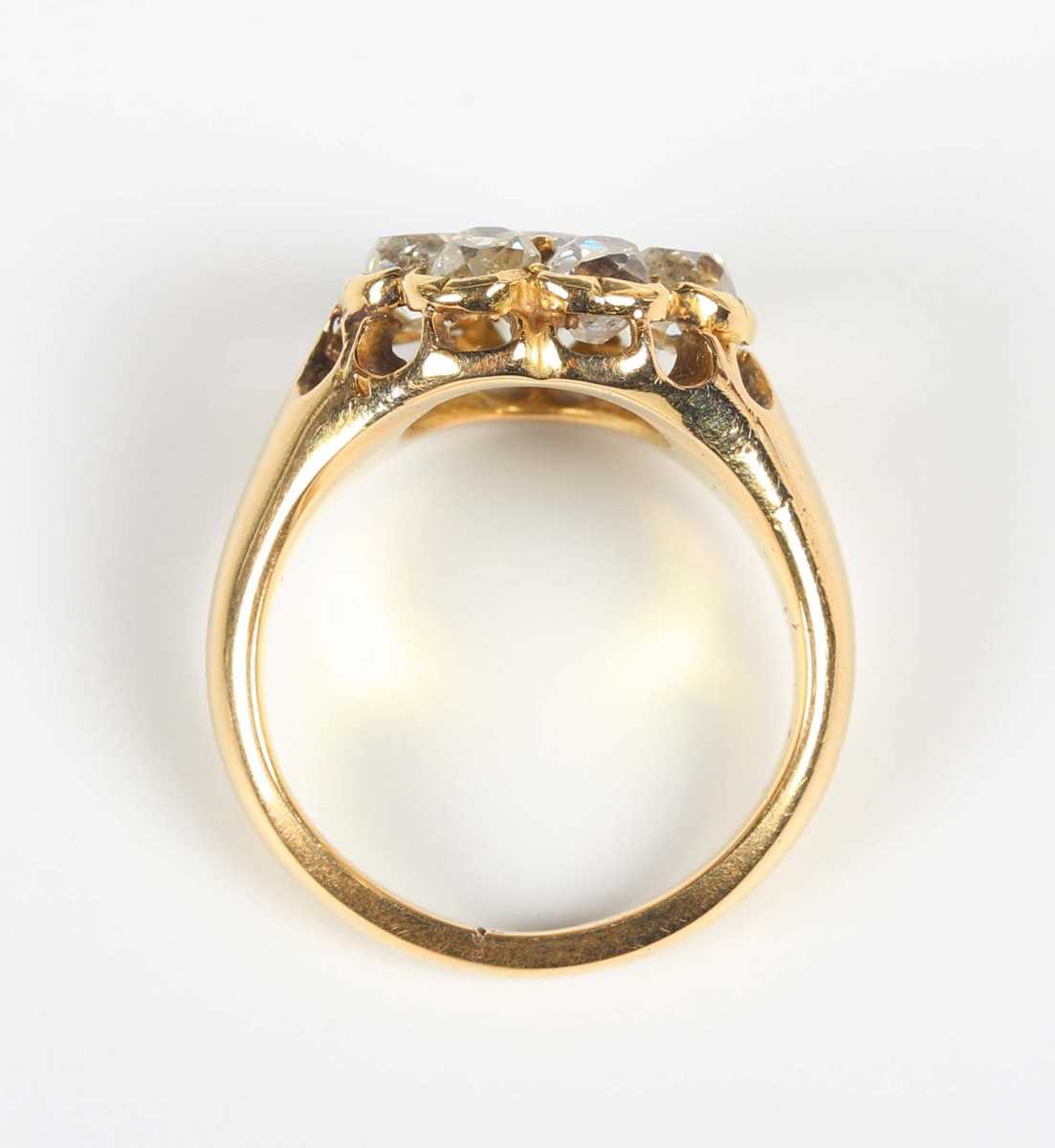 A gold and diamond cluster ring, claw set with a central old mine cut diamond within a surround of - Image 4 of 5